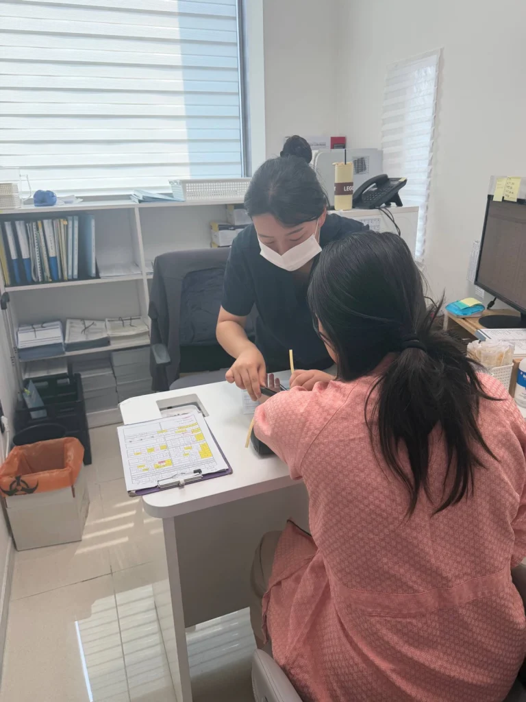 Our coordinator and a patient go through results with a clinic staff member